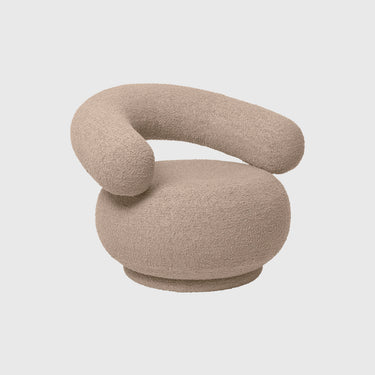 Beige abstract sculpture on a light gray background