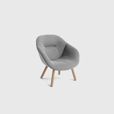 A gray upholstered AAL 82 Soft lounge chair with a wooden base and rounded legs.