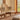 Audo Copenhagen Penguin Wooden Lounge Chair with beige upholstery interior image.