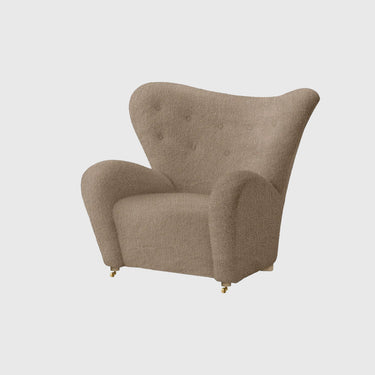 Beige armchair on a light gray background