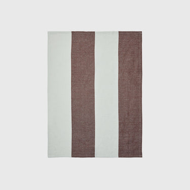 Rectangular tea towel with brown and white stripes on a light grey background