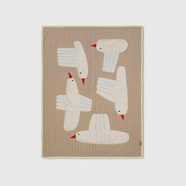 A quilted blanket with a sand background featuring appliquéd birds in various colors on it.