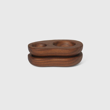 Wooden bowl set on a light gray background