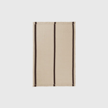 Woven striped flat rig on a light grey background.