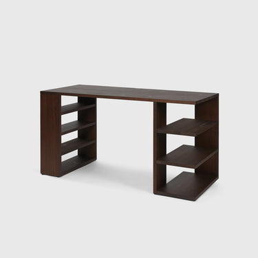 Free standing side angle view of a dark wooden desk with shelves either side on a light grey background.