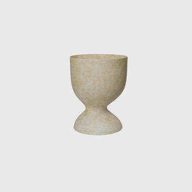 A beige, medium-sized, fiber stone pot suitable for indoor and outdoor use.