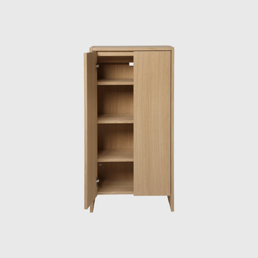 Wooden cabinet with one door open on a white background