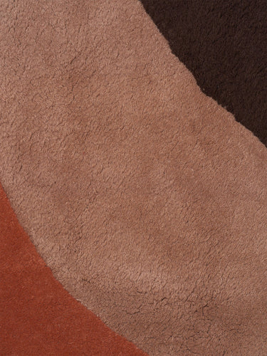Close-up of a textured brown fabric with a wavy pattern
