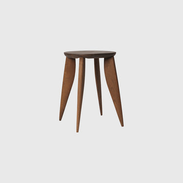 Wooden stool with three legs on a light gray background