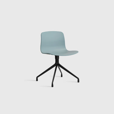 Modern chair with a light blue seat and black metal base on a white background