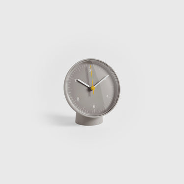 Gray clock with a white background
