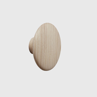 Wooden knob on a light gray background