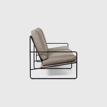 Side view of a two seater outdoor sofa on a light grey background.