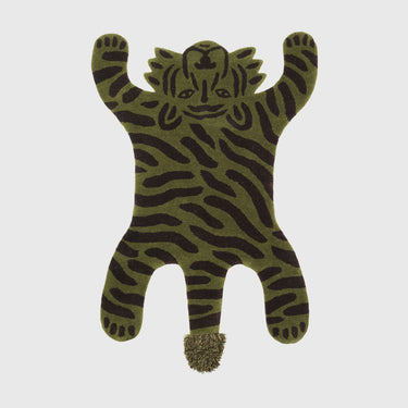 A tufted rug shaped like a tiger with a camouflage pattern in green and black.
