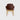 A modern dining chair with a dark brown molded seat and back upholstered in smooth material, supported by four light natural wood legs, shown against a solid light grey background.