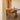 Wooden dining table with chairs in a minimalistic room.