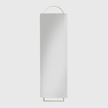 A minimalist rectangular wall mirror with a thin gold metal hanging loop at the top and a matching gold frame at the bottom, shown against a solid light gray background.
