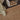 Close up of interior detail of a natural jute rug on a varnished dark wood floor.