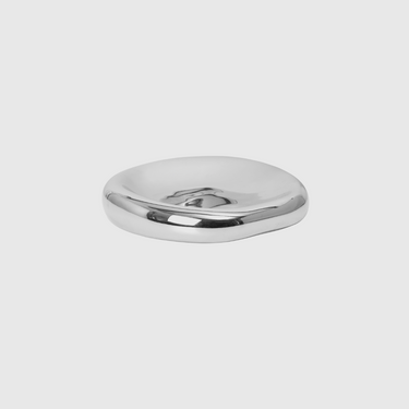 Silver soap dish on a light gray background