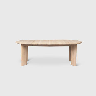 White Oiled Oak extendable table on a light grey background.  