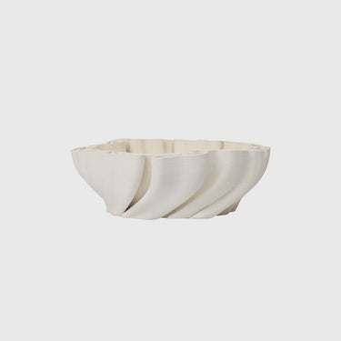 White ceramic bowl on a light grey background