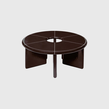 Round dark brown coffee table with a central hole on a light gray background