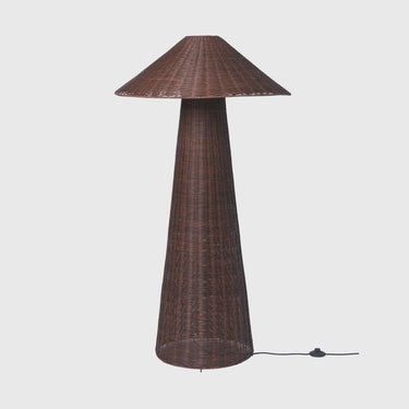 A dark brown woven outdoor patio table lamp with a tapered conical shade and base, shown on a light grey background with its power cord visible.