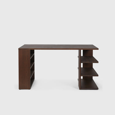 Free standing dark wooden desk with shelves either side on a light grey background. 
