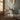 Interior room image with a walnut cured desk, freestanding chair and on a jute rug.