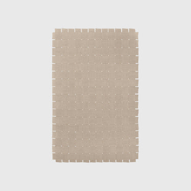 Rectangular woven mat with a grid pattern on a light gray background