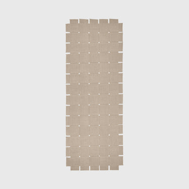Rectangular woven mat with a grid pattern on a light gray background