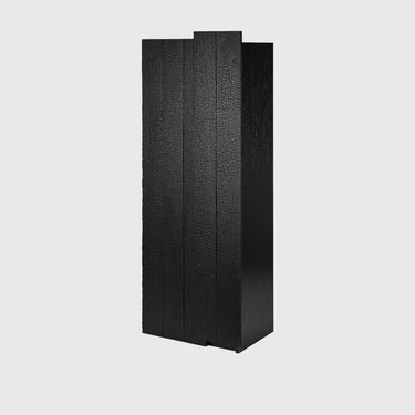 A modern black textured cabinet or sideboard with a vertical slatted front design, shown against a plain light gray background.