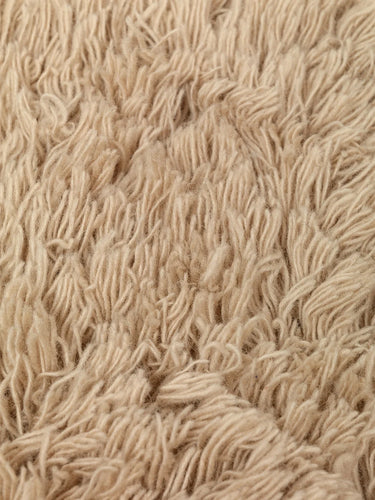 Close-up of beige textured fabric