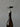 Cork being pulled out of a bottle with a corkscrew against a gray background