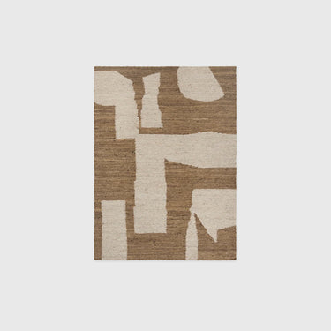 A rectangular area rug with an abstract geometric pattern in natural brown and cream, shown flat against a light gray background.