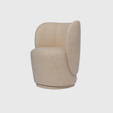 A modern barrel-style accent chair upholstered in a textured beige fabric, shown from a three-quarter angle against a light gray background.