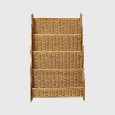 A natural woven wicker bookcase with four tiers and open side panels, shown against a solid light gray background.
