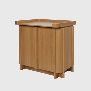 Wooden cabinet with a light brown finish on a white background