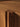 Close-up of a wooden furniture joint with a warm brown color.