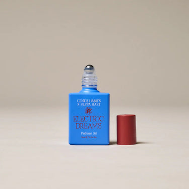 Perfume oil bottle labeled 'Electric Dreams' by Gentle Habits on a beige background