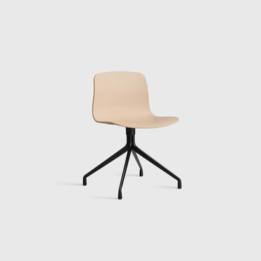 Beige chair with black metal base on a white background