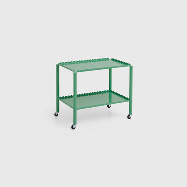 A green Arcs Trolley Low with vertical arcs forming shelves, supported by slim legs on castors.
