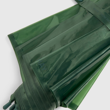 Green plastic bags with a brand logo on a white background