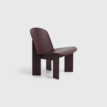 A contemporary black Chisel Lounge Chair designed by Norwegian designer Andreas Bergsaker in bordeaux