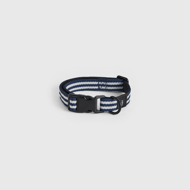 Navy and white striped dog collar on a light gray background
