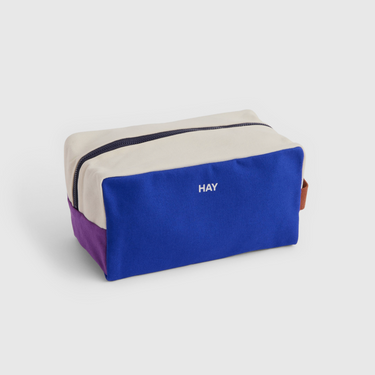 multicolour featuring electric blue wash bag on grey background 