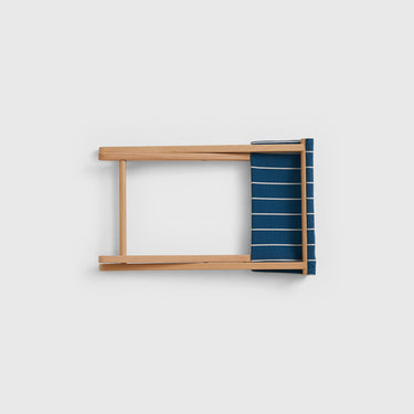 Wooden stool folded flat on a white background