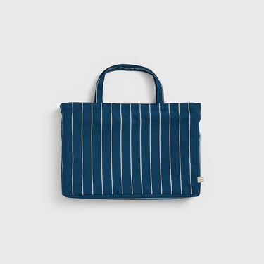 Blue striped tote bag on a light gray background