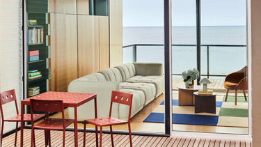 Hay Balcony table and chairs in iron red with Quilton interior