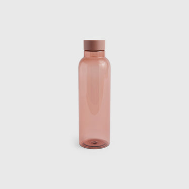 A translucent dusty rose pink water bottle with a matching screw-on lid, centered on a light gray background.